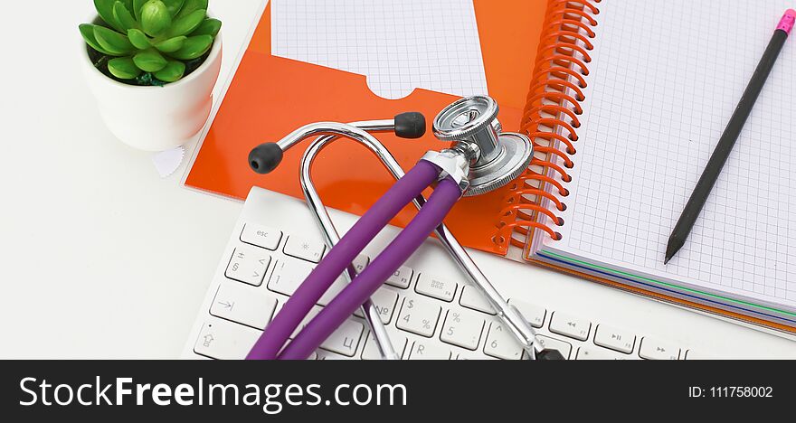 Doctor`s workspace working table with patient`s discharge blank paper form, medical prescription, stethoscope on desk