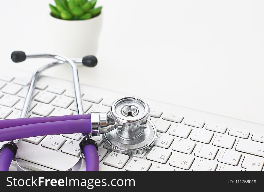 A Stethoscope Is On The Keyboard Of A Computer