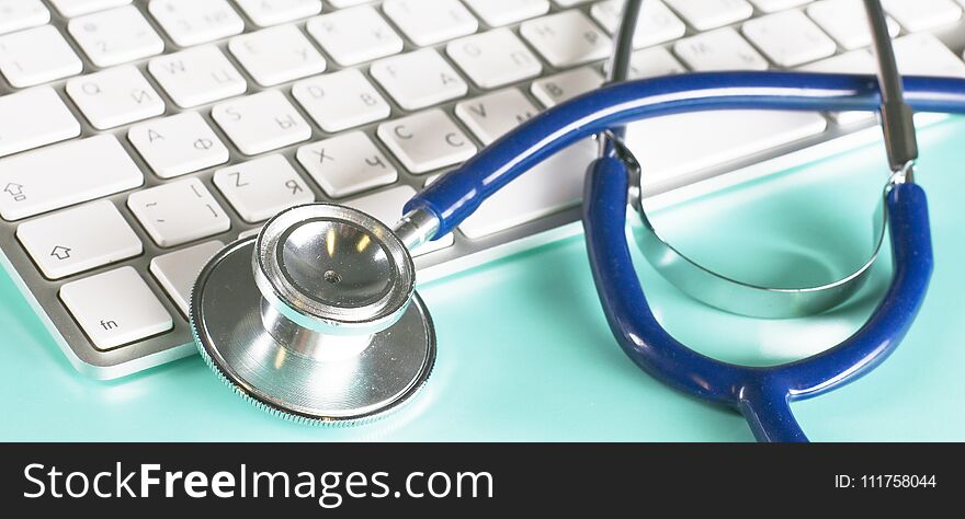 A Stethoscope Is On The Keyboard Of A Computer