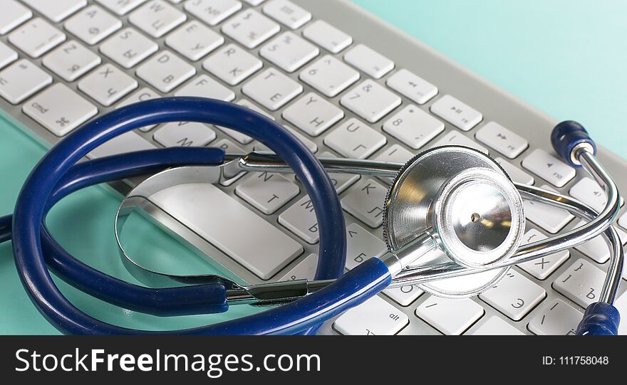 A Stethoscope Is On The Keyboard Of A Computer