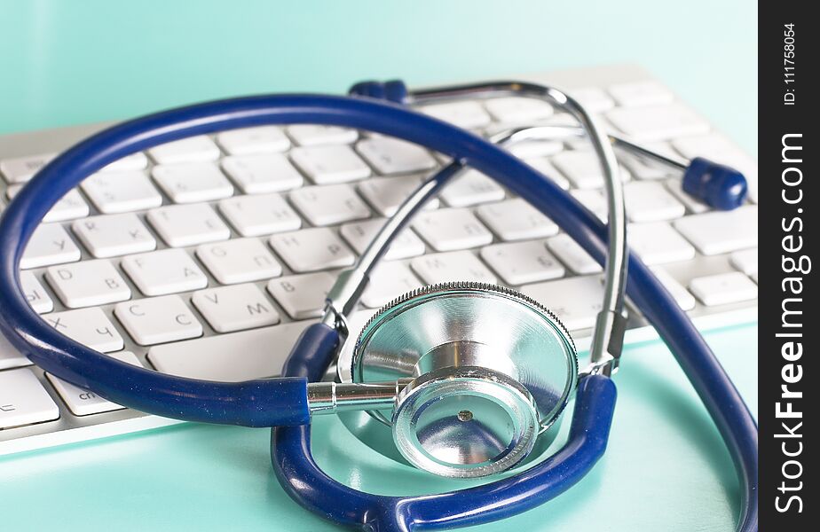 A Stethoscope Is On The Keyboard Of A Computer