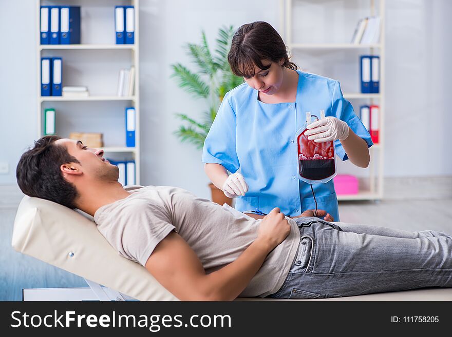 The patient getting blood transfusion in hospital clinic