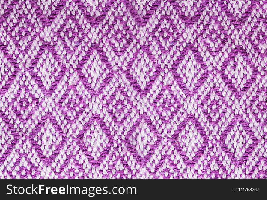 Texture of the fabric surface made of knitted natural cotton fiber, purple-lilac pattern,d