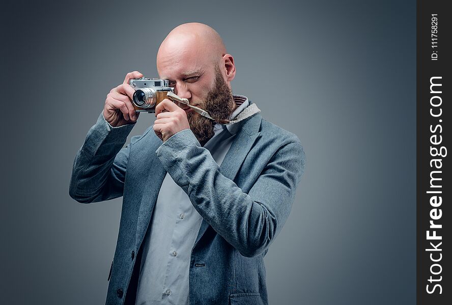 A Man Shooting With Vintage SLR Photo Camera.