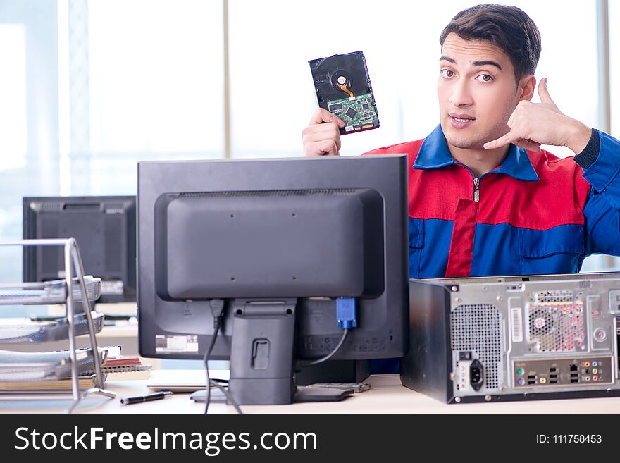 The data restoration specialist repairing corrupt hard drive