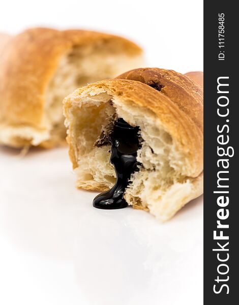 Traditional france breakfest croissant with chocolate isolated on white background