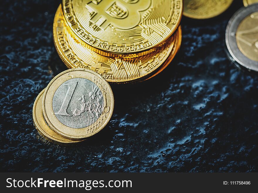 Virtual currency Bitcoin and Euro coin on dark table