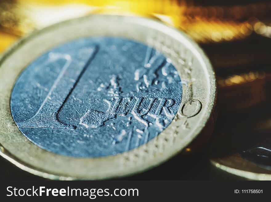 Virtual currency Bitcoin and Euro coin on dark table