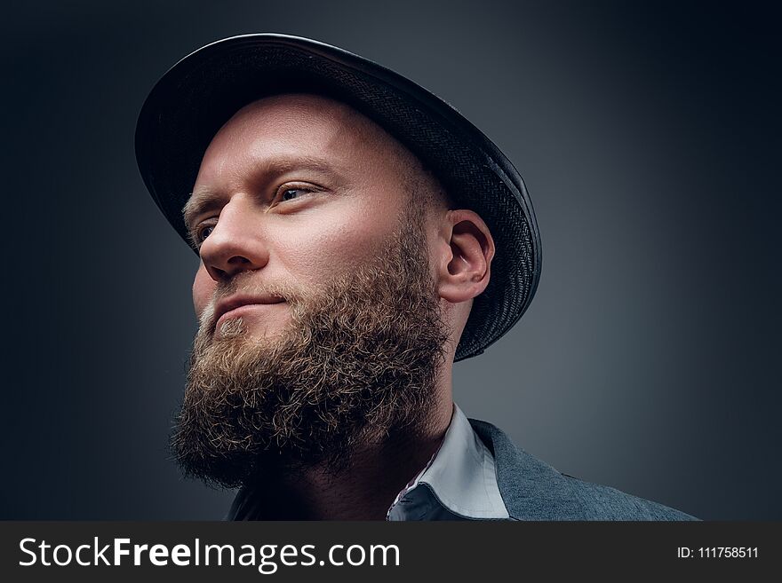 Close up portrait of bearded male in a felt hat.