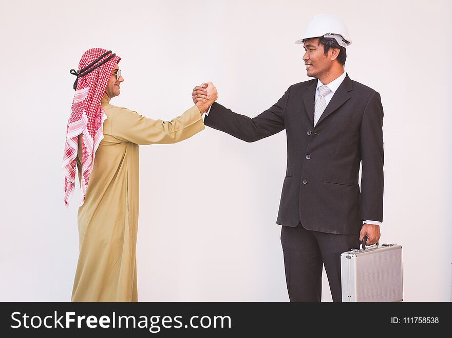 Arab businessman and foreman worker handshaking