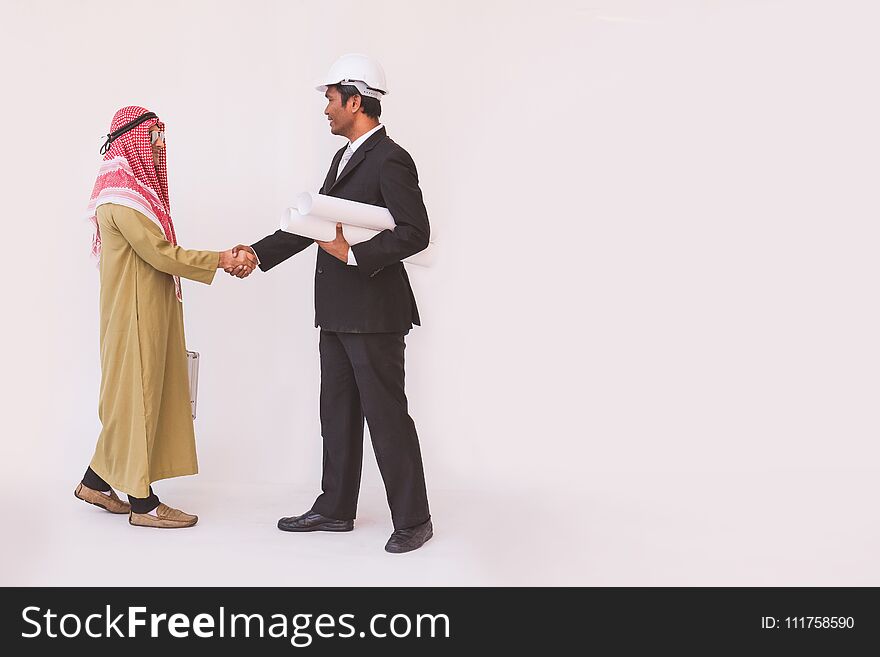 Arab businessman and foreman worker handshaking, man