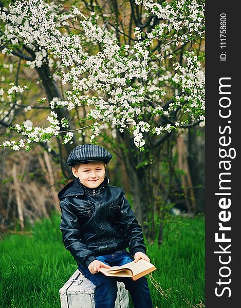 Boy On A Walk In The Garden In The Spring