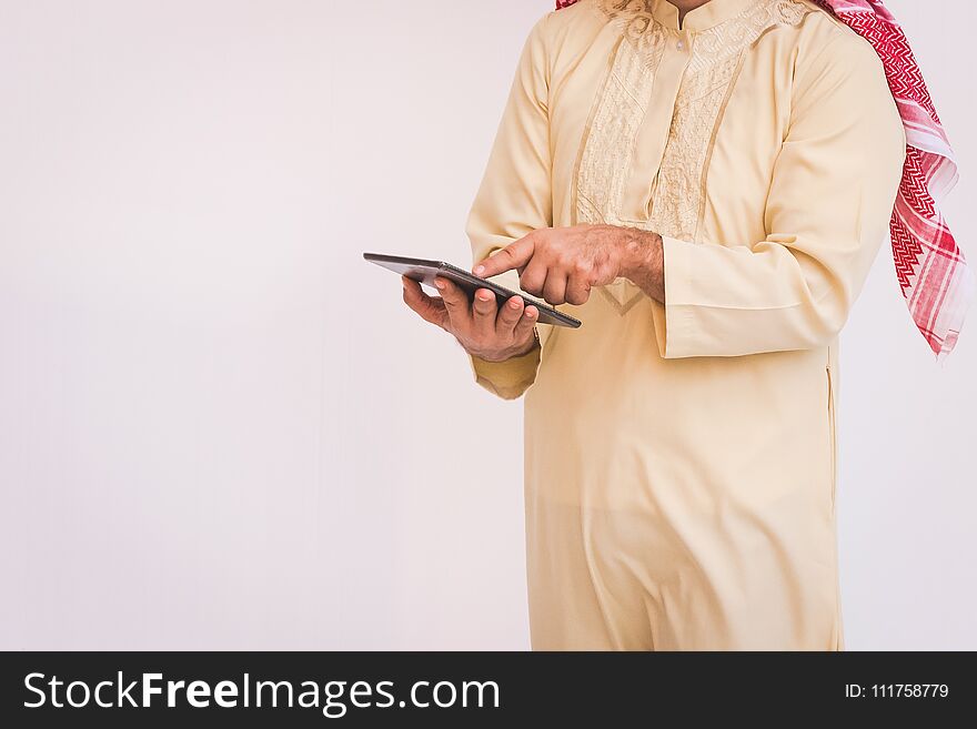 Arab businessman useing on a mobile phone.