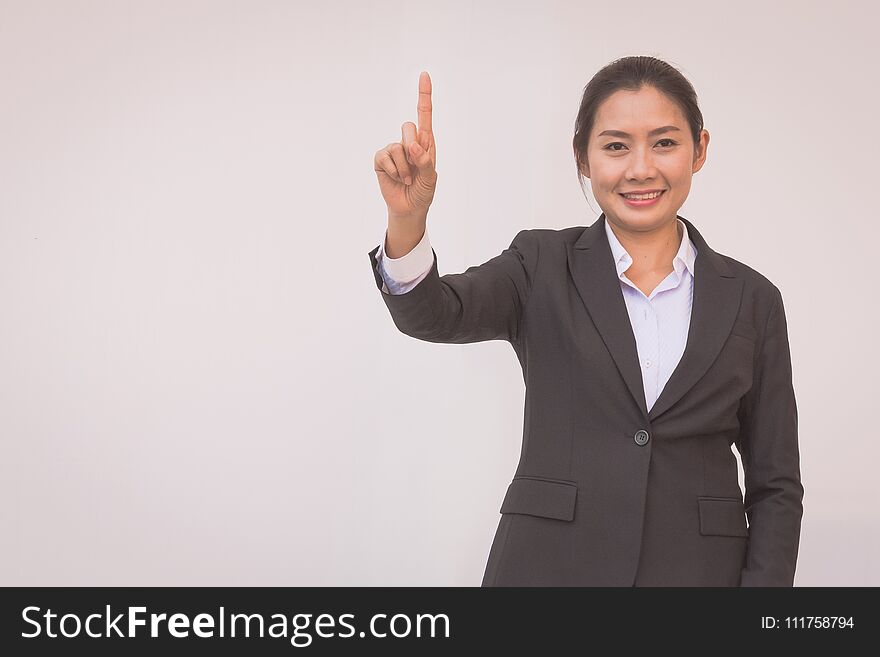 Happy young businesswoman with hands up.