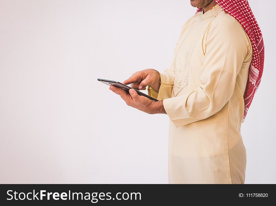 Arab businessman useing on a mobile phone, man