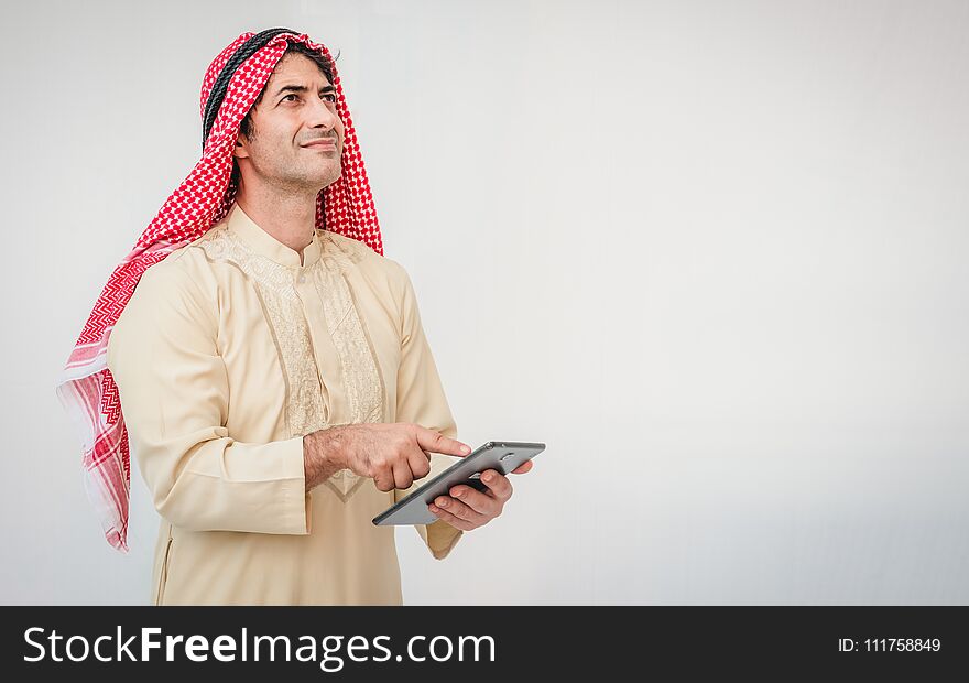 Arab businessman useing on a mobile phone