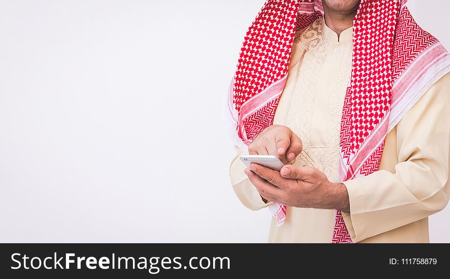 Arab businessman useing on a mobile phone.