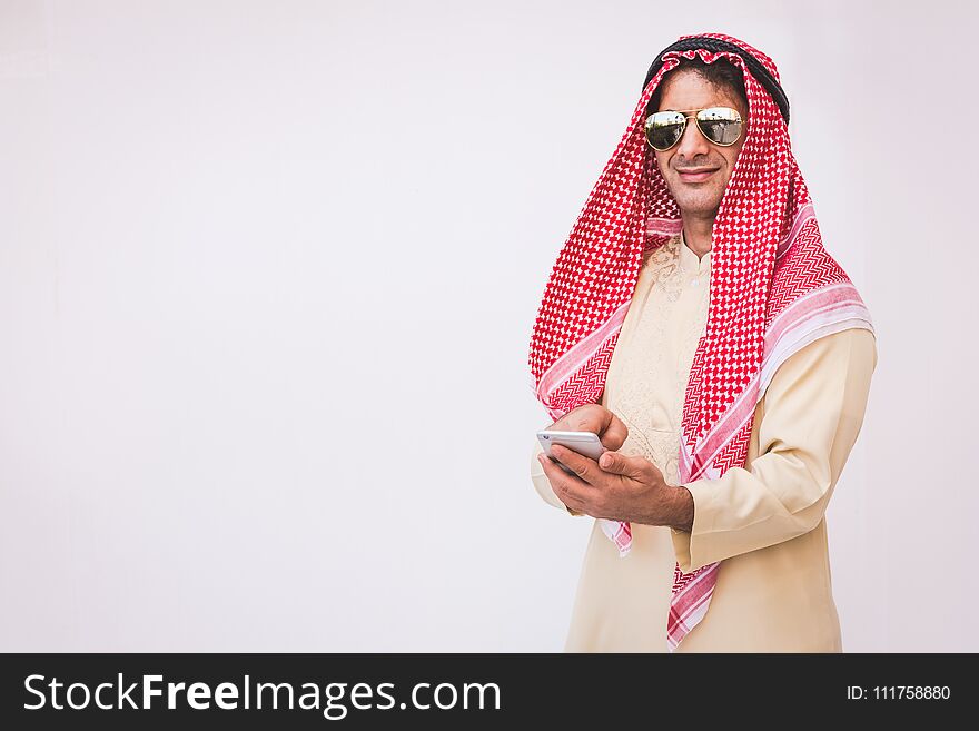 Arab businessman useing on a mobile phone