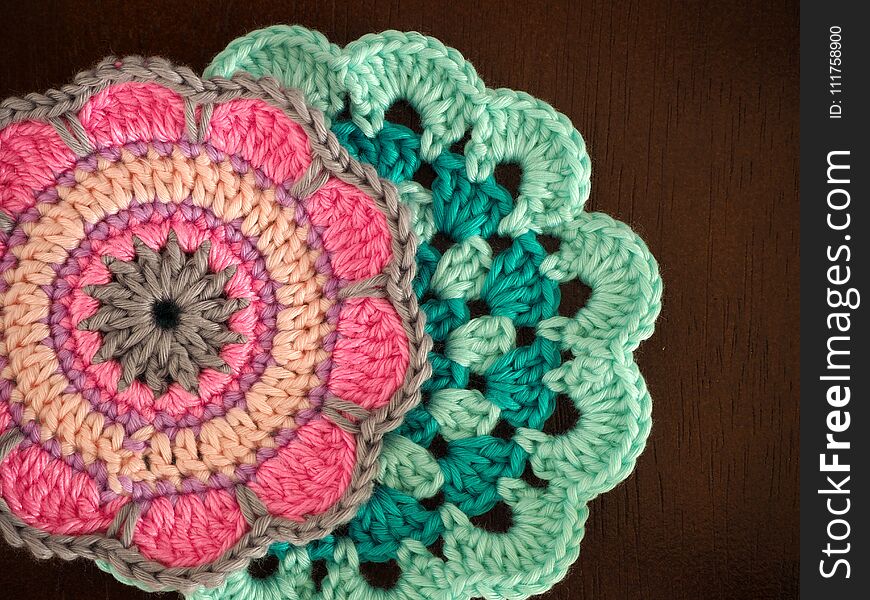 Knitting saucer, crochet work on the table, Top view of pink yarn