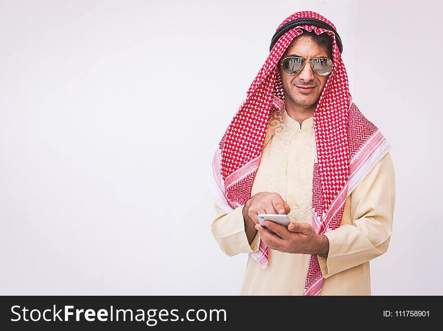 Arab businessman useing on a mobile phone, man