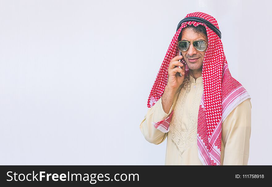 Arab businessman useing on a mobile phone, man