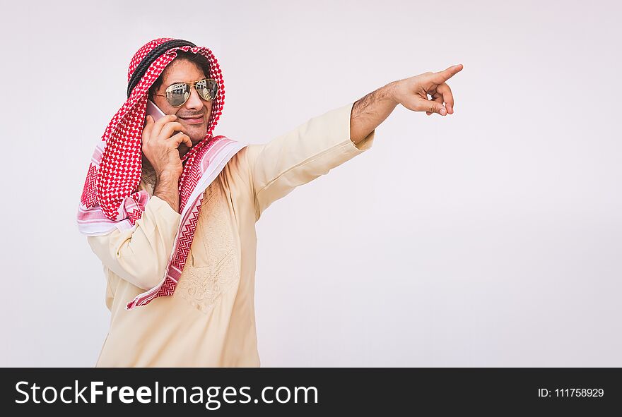 Arab businessman useing on a mobile phone.