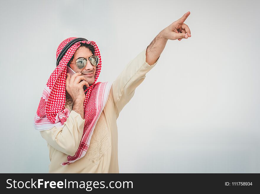 Arab businessman useing on a mobile phone, man