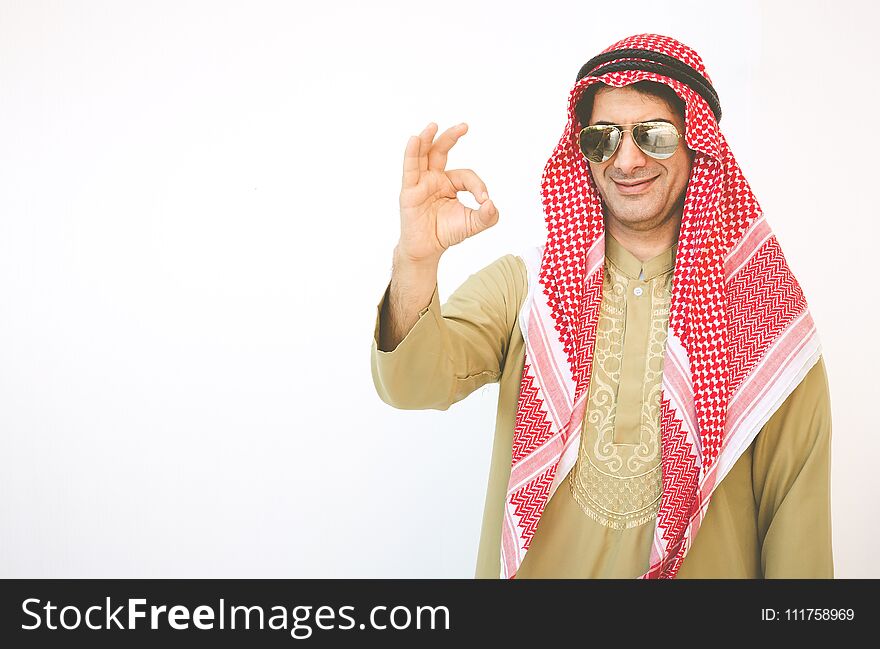 Arab businessman pointing up ok hand sign, man