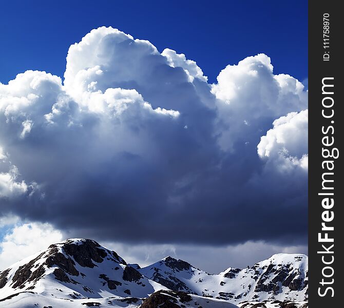 Snowy Mountains And Sky With Clouds