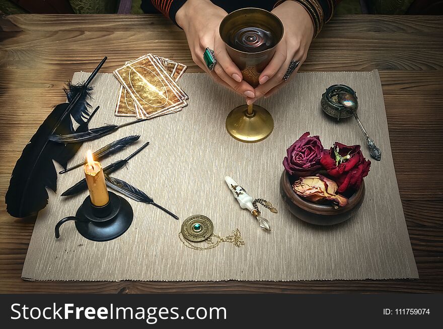 Woman witch prepare a magic potion. Tarot cards. Future reading. Fortune teller concept.