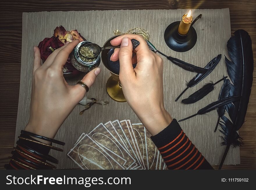 Woman witch prepare a magic potion. Tarot cards. Future reading. Fortune teller concept.