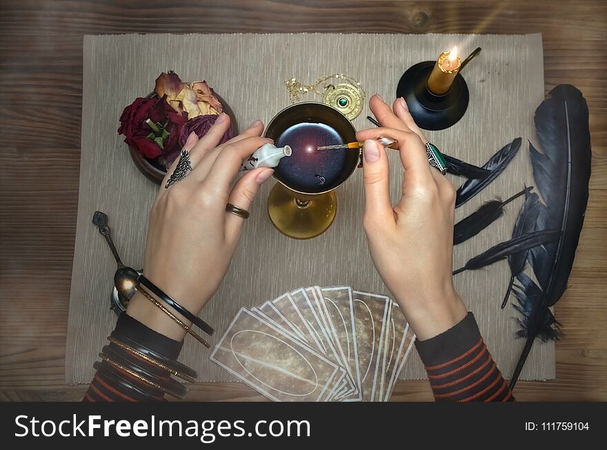 Magic potion. Tarot cards on fortune teller desk table. Future reading. Magic potion. Tarot cards on fortune teller desk table. Future reading.