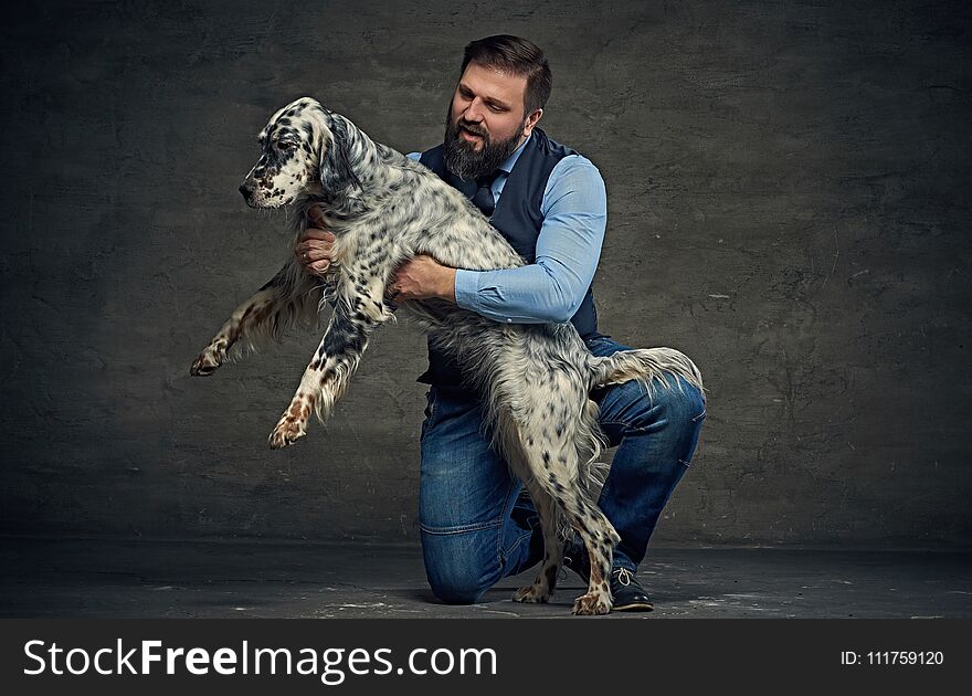 Stylish bearded middle age male and Irish setter. Stylish bearded middle age male and Irish setter.