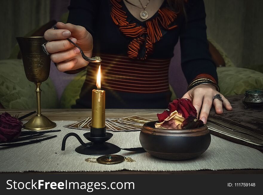 Woman witch prepare a magic potion. Tarot cards. Future reading. Fortune teller concept.