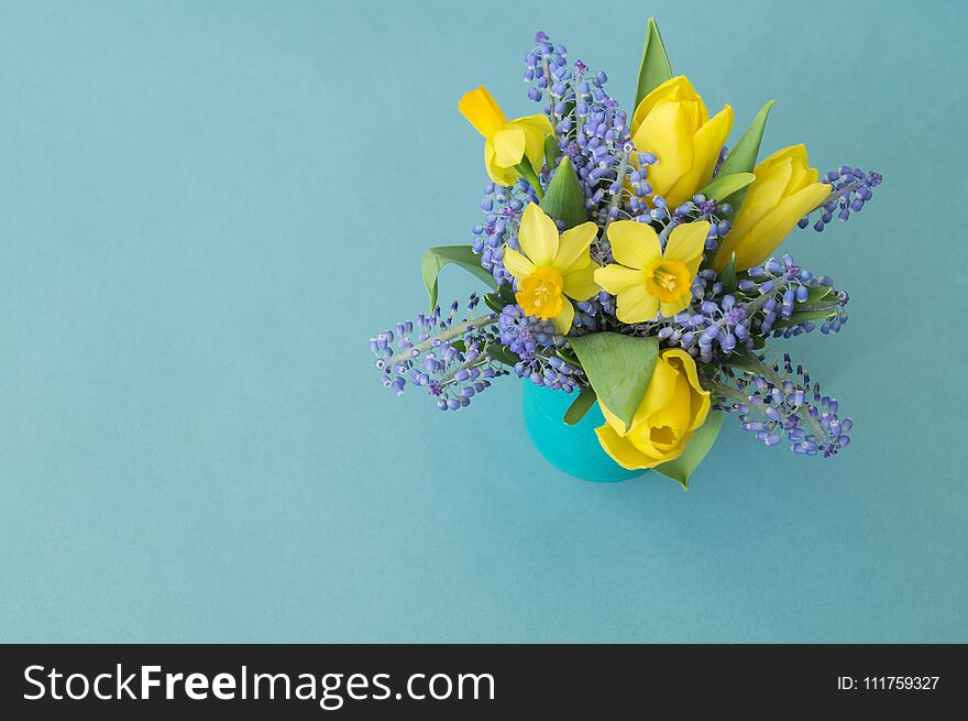 Bouquet Of Daffodils, Tulips And Muscari.Easter. Easter Eggs Are Blue And Turquoise.