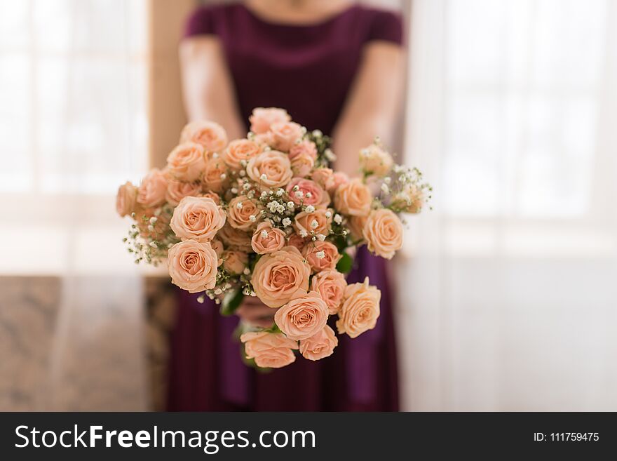 Girl Hold A Bouquet Of Cream Roses.