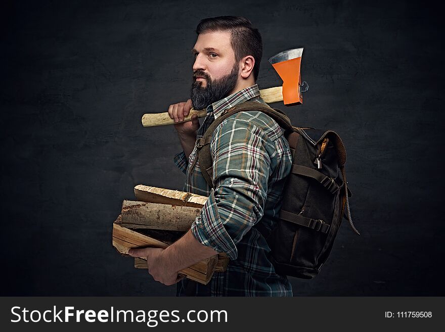 Bearded Middle Age Male Holds An Axe And Firewoods.