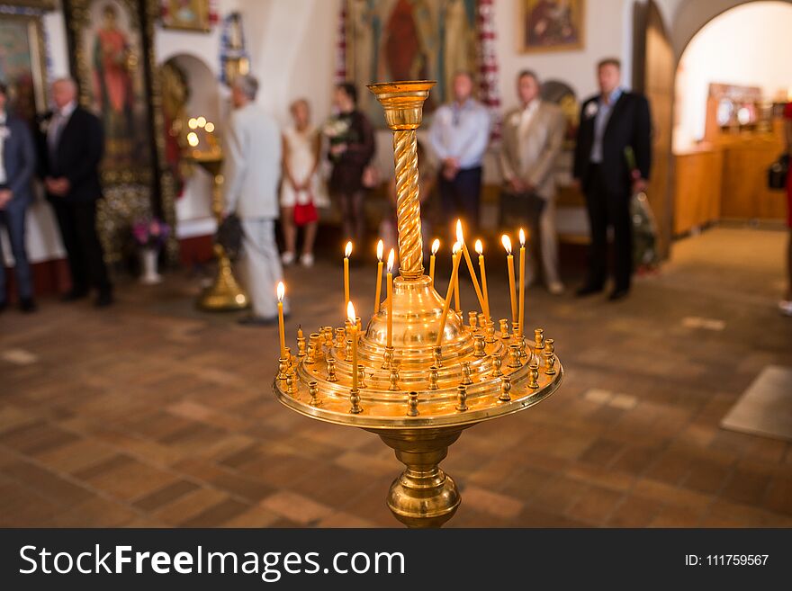 Burning Wax Candles In A Candlestick In The Church.