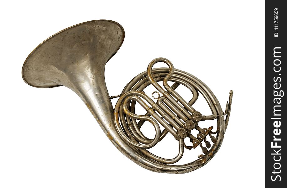 Old vintage rusty French horn on a withe background, isolated