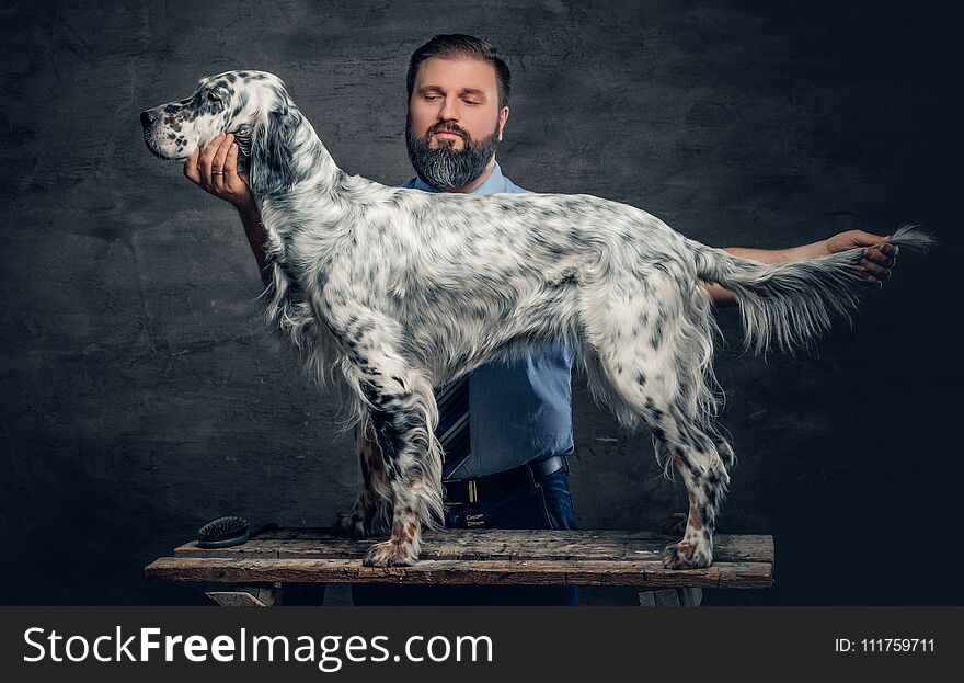 Stylish bearded middle age male and Irish setter. Stylish bearded middle age male and Irish setter.