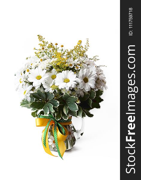 Feminine simple bouquet consisting, mimosa, chamomile in vase on white background ,delicate, summer