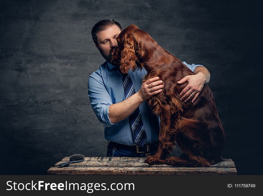 Stylish bearded middle age male and his mammals friend Irish red setter. Stylish bearded middle age male and his mammals friend Irish red setter.