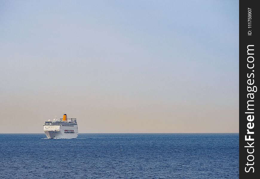 Ferryboat on the open sea at sunrise