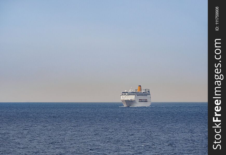 Ferryboat on the open sea at sunrise