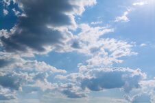 White Curly Clouds In A Blue Sky. Sky Background. Royalty Free Stock Image
