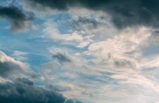 White Curly Clouds In A Blue Sky. Sky Background. Royalty Free Stock Images