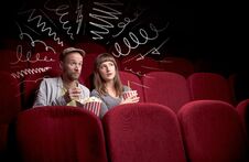 Cute Couple In Cinema Watching Movie Royalty Free Stock Photo