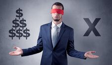 Man With Ribbon On His Eye Holding Dollar Signs Royalty Free Stock Photography Man With Ribbon On His Eye Holding Dollar Signs Royalty Free Stock Photography