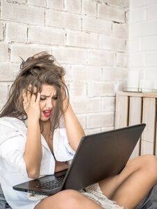 Pretty Young Woman Got Bad News From Email Early Morning Royalty Free Stock Images