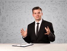 Businessman Sitting At A Desk Royalty Free Stock Image